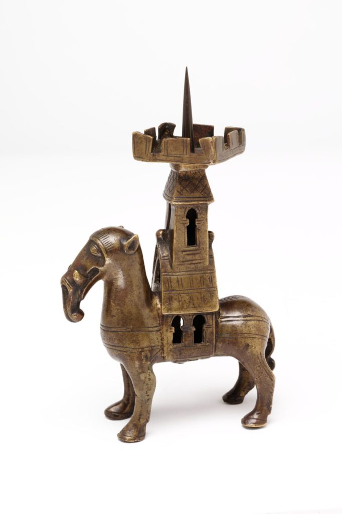 Medieval statue featuring an elephant with a a castle