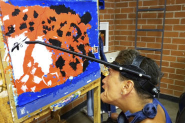 Artist Bea Olea using a head tool.