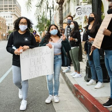 Elise Tervalon and friend protesting