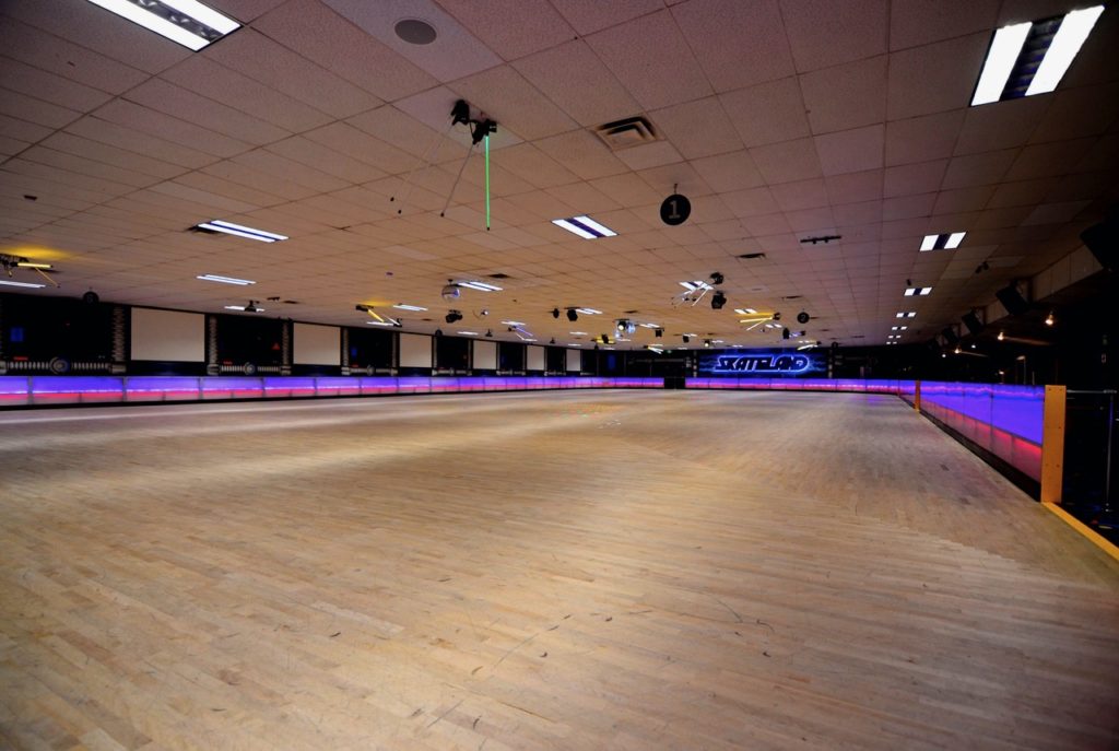 An empty indoor roller rink.