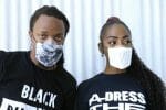 Two Black people model Threadhaus face masks.