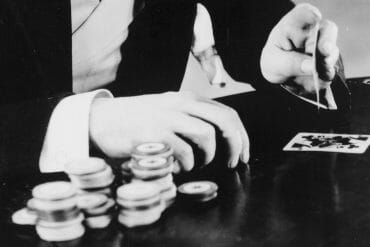 A man playing cards and gambling.
