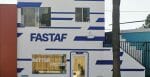 A storefront painted white with blue strips, emblazoned with "FASTAF."
