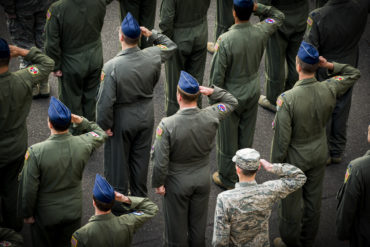Members of the 374th Operations Group salute during a retreat ceremony March 17, 2017, at Yokota Air Base, Japan.