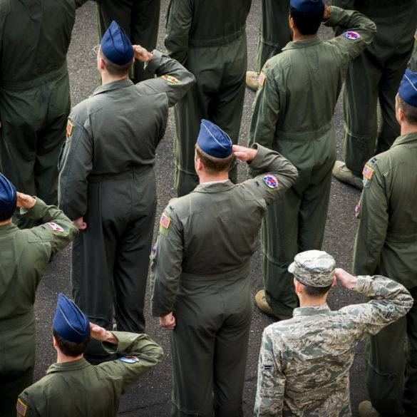 Members of the 374th Operations Group salute during a retreat ceremony March 17, 2017, at Yokota Air Base, Japan.